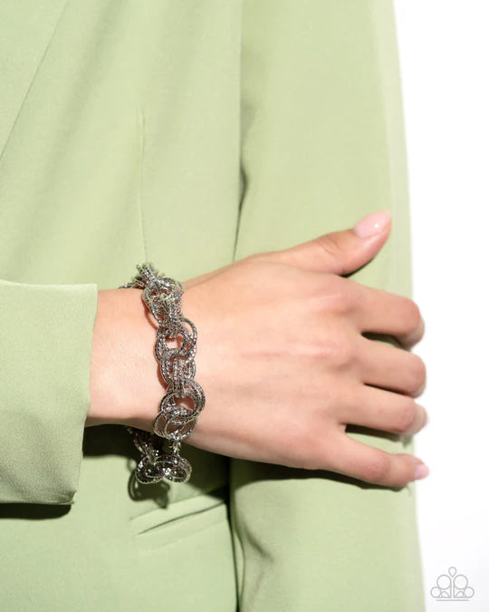 Audible Shimmer - Silver Textured Circle Clasp Bracelet