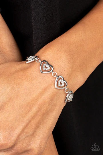 Catching Feelings - White Rhinestone Silver Heart Clasp Bracelet