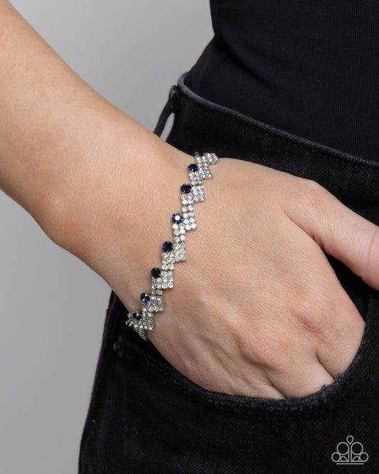 Fateful Finish - Blue and White Rhinestone Silver Clasp Bracelet