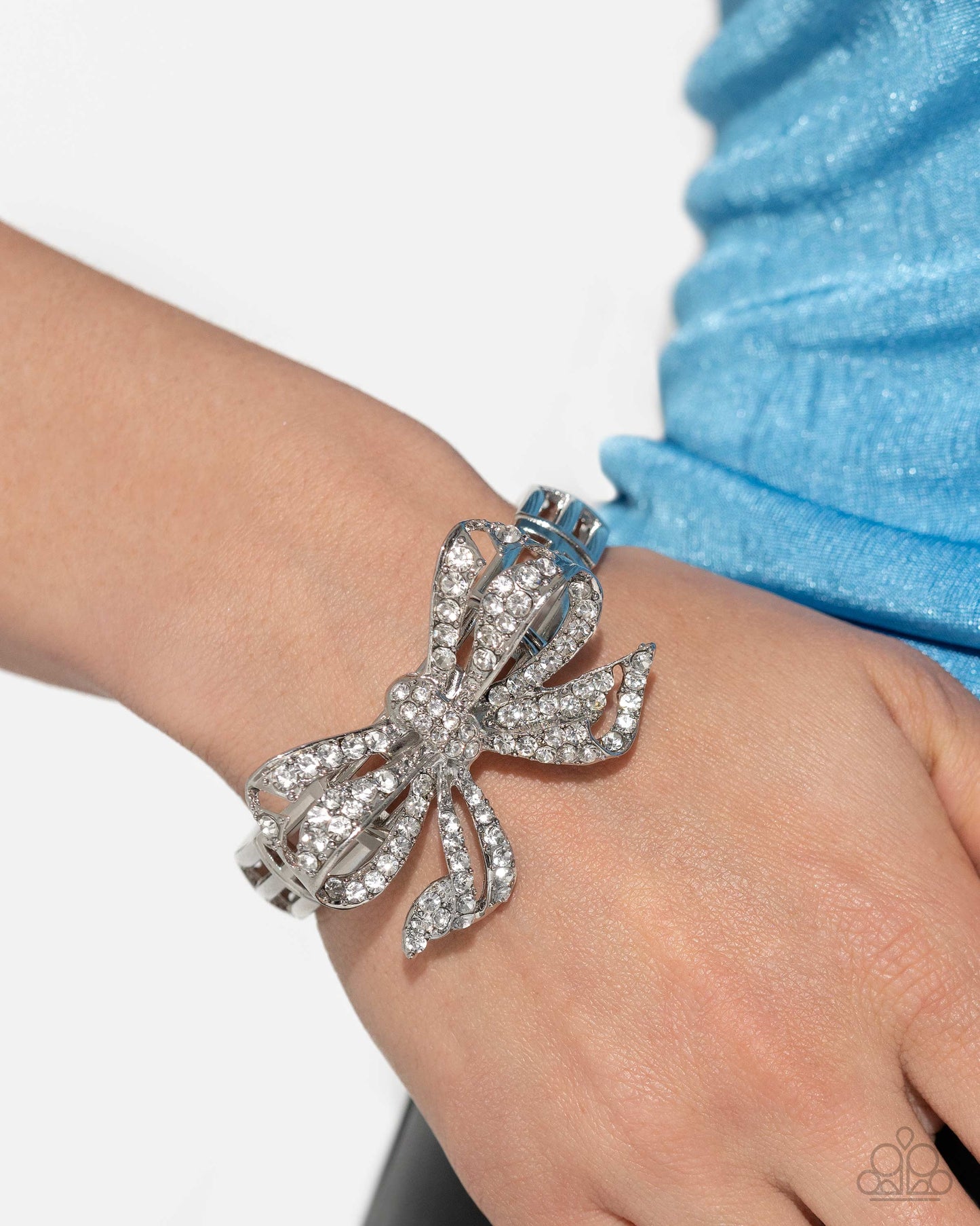 It's All A-BOW-t Me - White Rhinestone Silver Bow Stretch Bracelet - Life of the Party